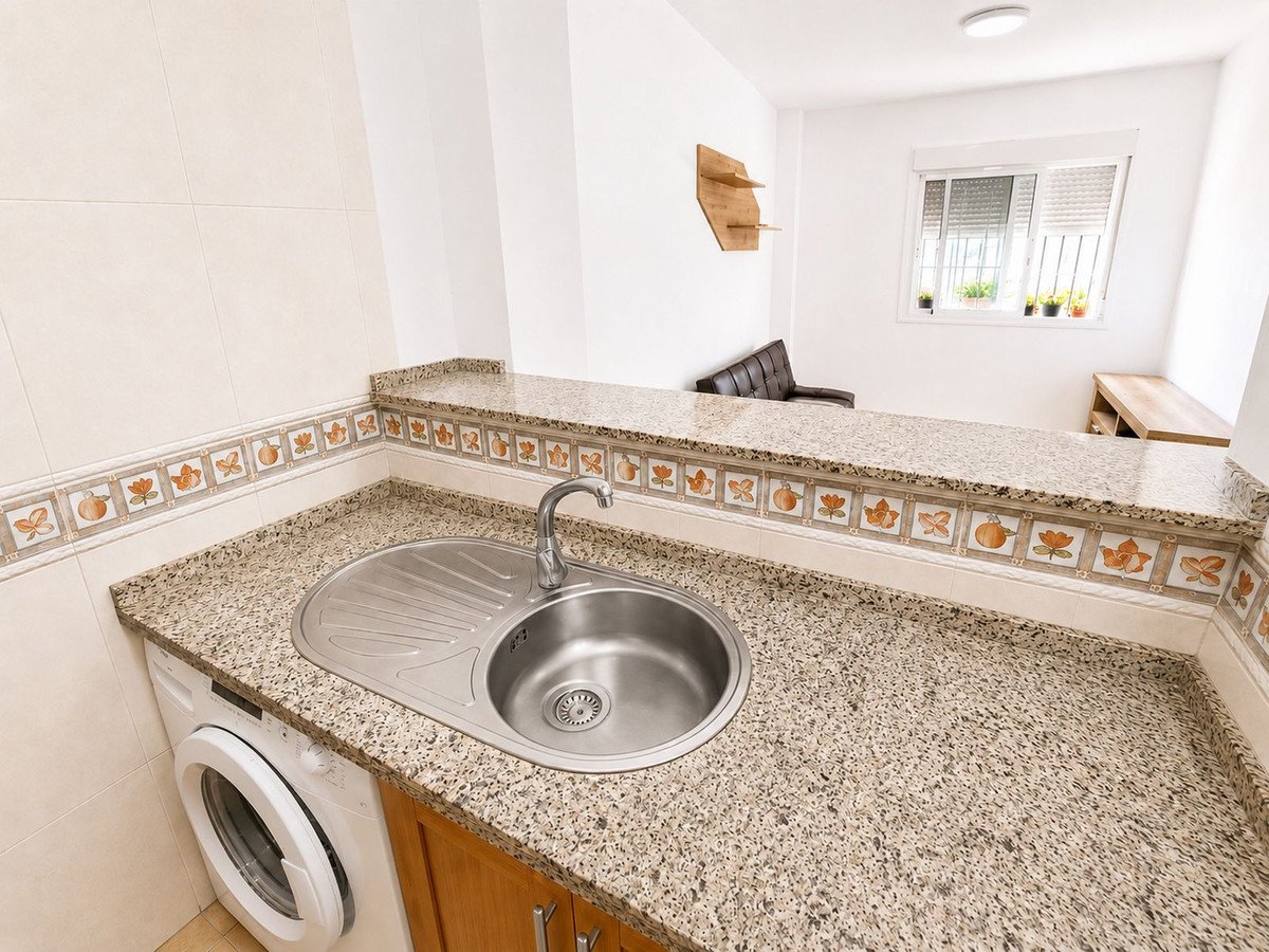 Modern kitchen with granite countertops and stainless steel sink