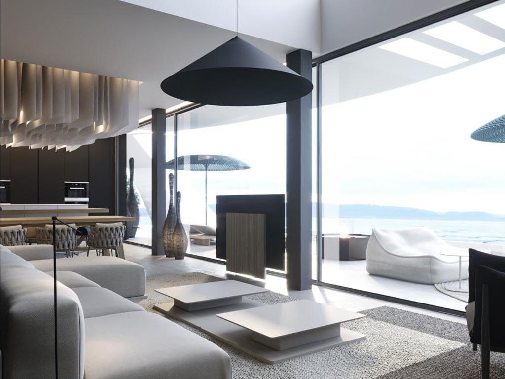 Modern living room with ocean view, large windows, and minimalist furniture.