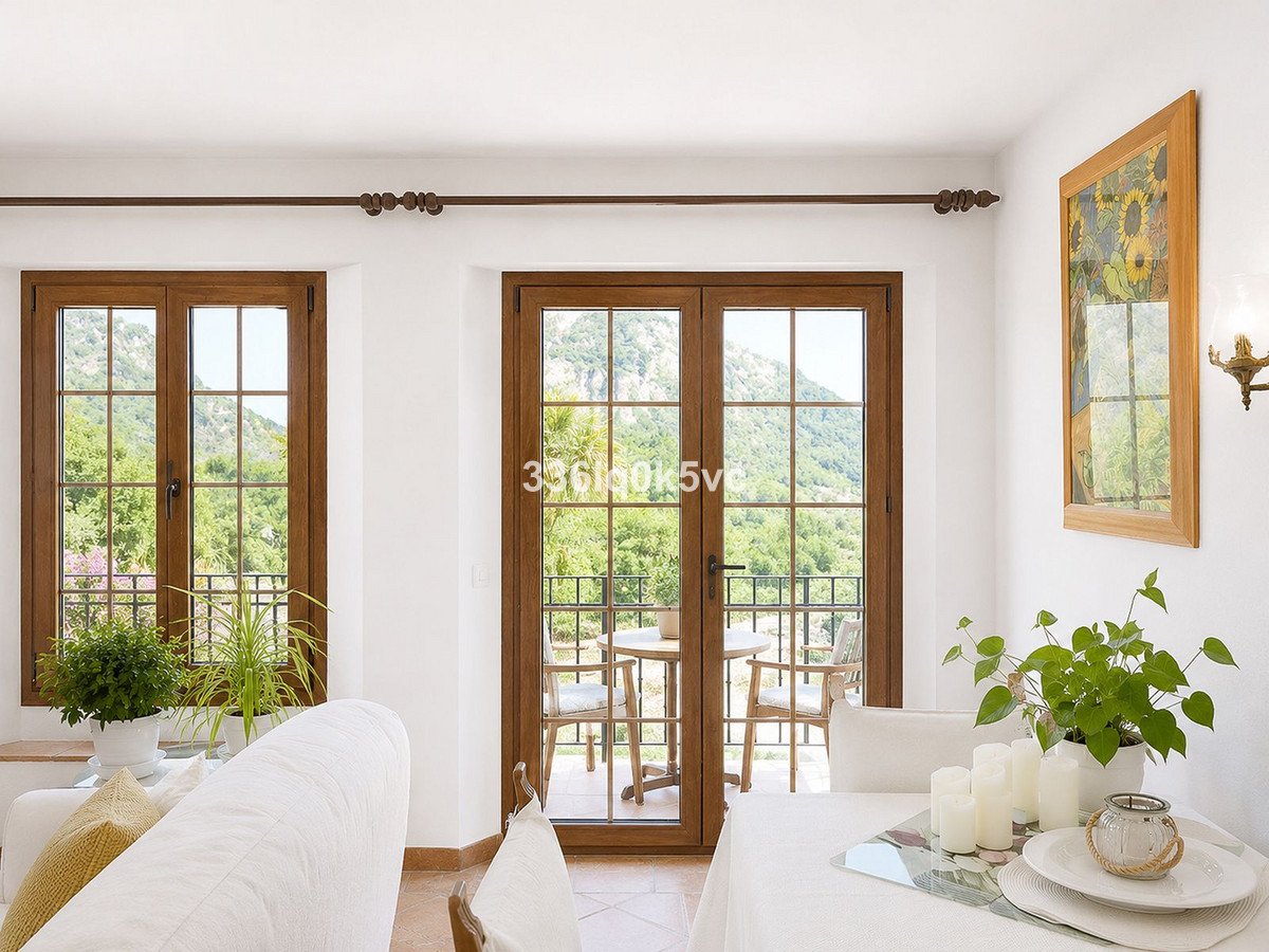 Bright living room with large windows and a view of the mountains