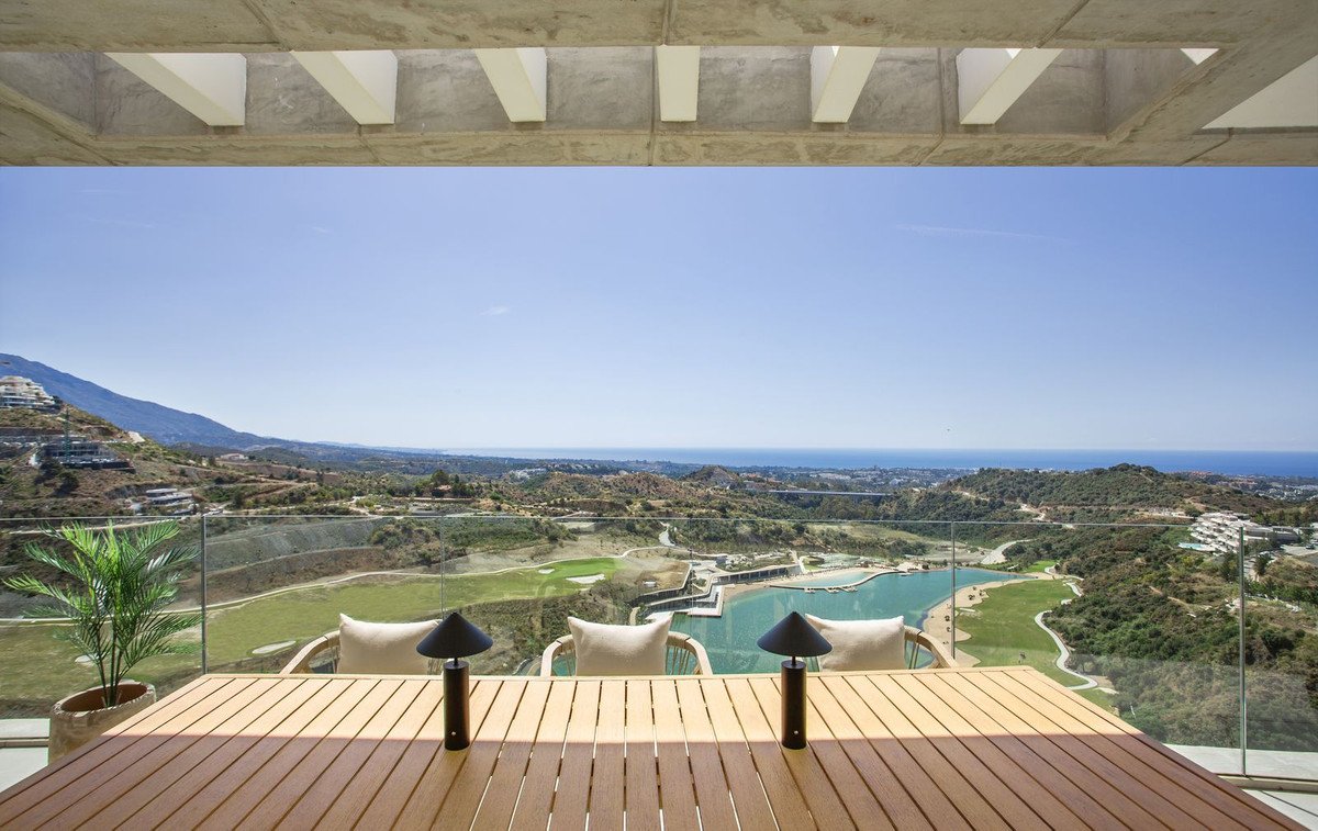 Terrace with infinity pool overlooking golf course and ocean