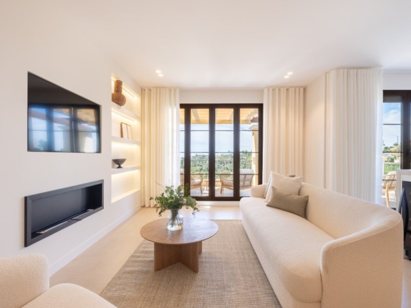 Modern living room with large windows overlooking the beach