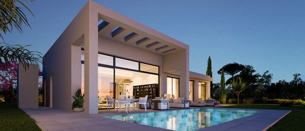 Modern villa with a swimming pool, outdoor seating area, and large windows overlooking the landscape.
