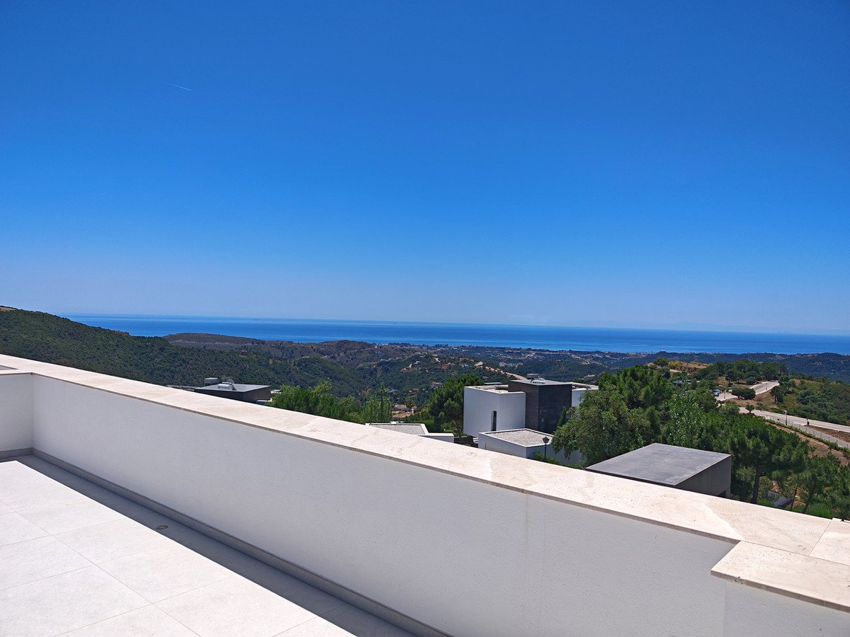 Clear view from rooftop overlooking the sea and surrounding landscape