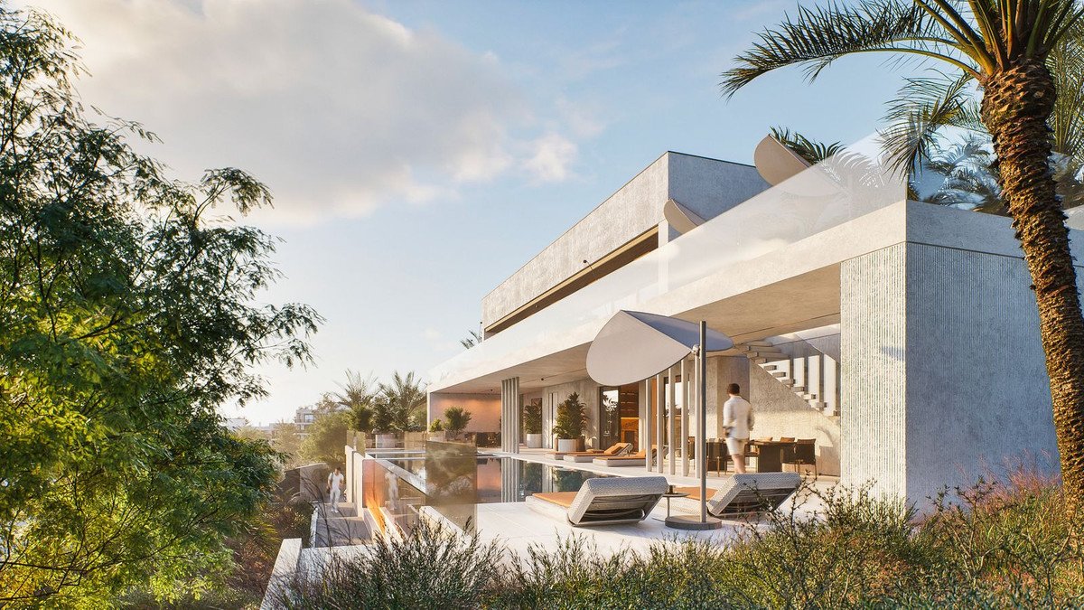 Modern villa with pool, lounge area, and palm trees under a sunny sky.