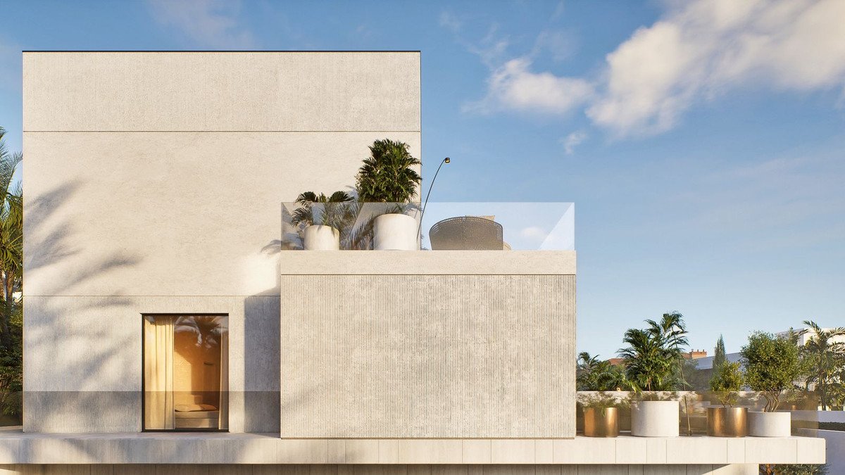 Modern villa with rooftop terrace, glass railing, potted plants, and large windows under a blue sky.