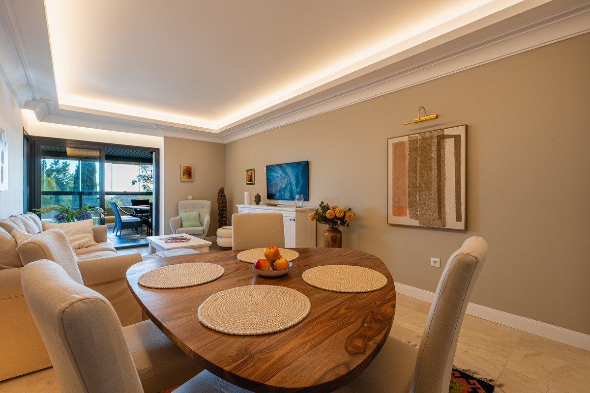 Modern living and dining room with open view to outdoor space