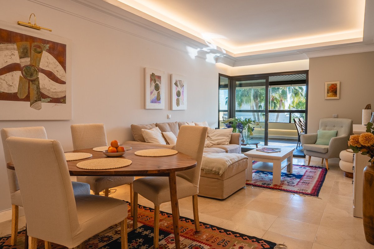 Spacious open-plan living and dining area with patio view