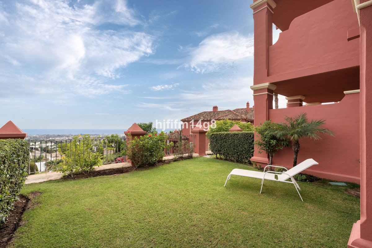 Apartment outdoor lawn with sea view and lounge chair