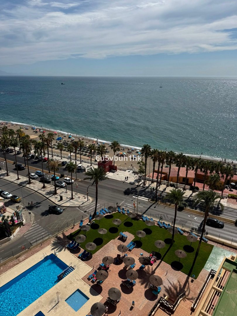 Apartment with ocean view, pool, and terrace overlooking beach