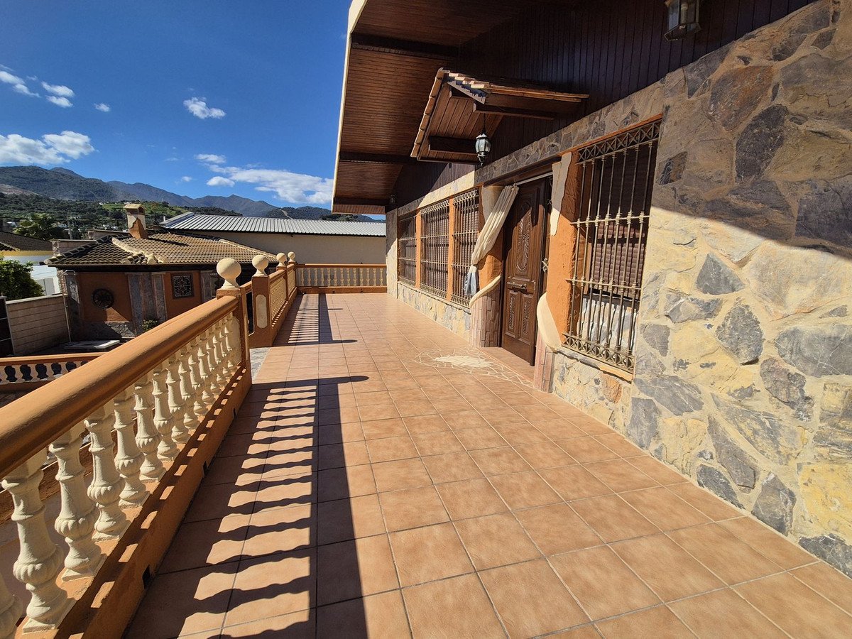 Balcony with stone wall and scenic mountain view