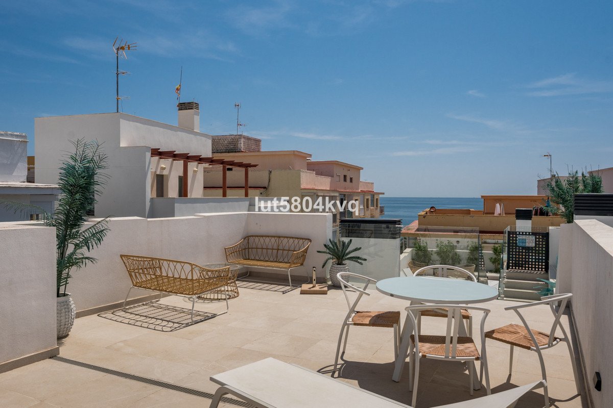 Balcony with outdoor furniture overlooking the sea
