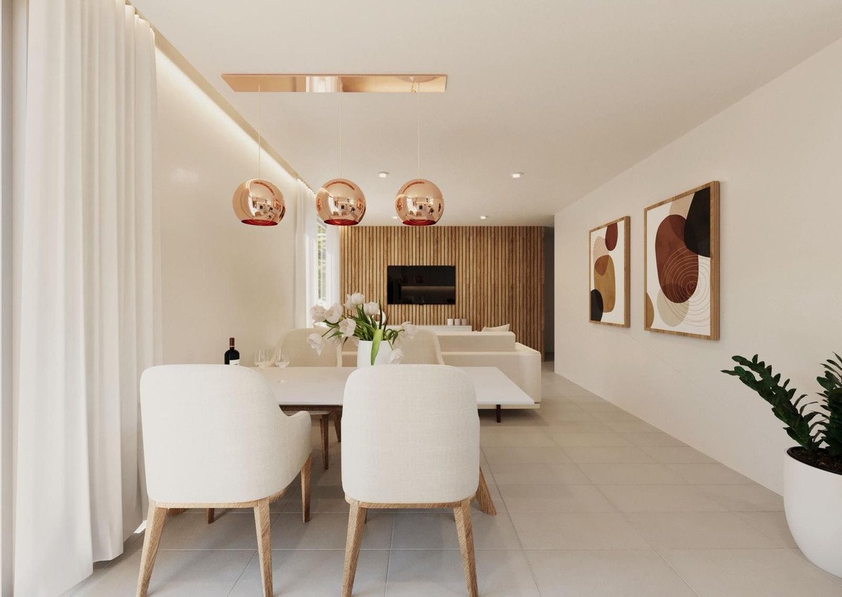 Modern living room with minimalist decor, white furniture, and abstract wall art