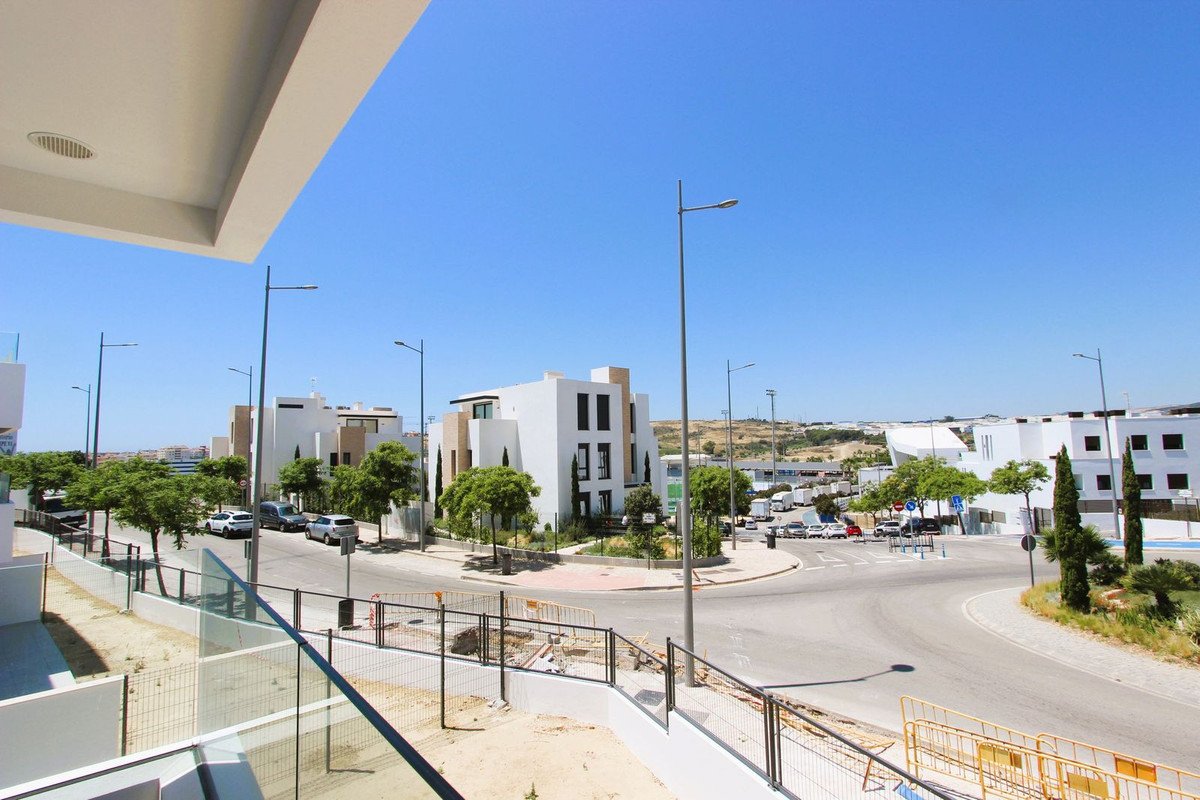 Modern street view with white houses and clear blue sky
