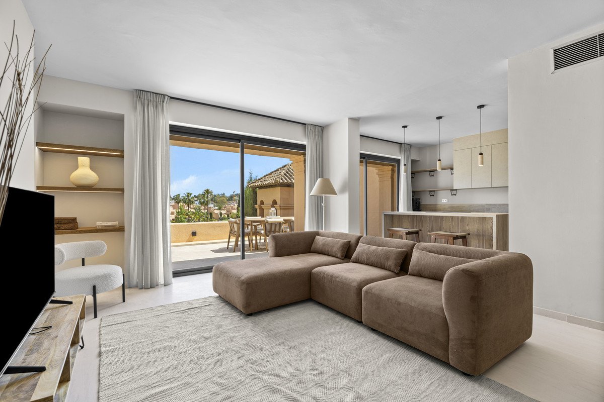 Modern living room with large windows overlooking a garden