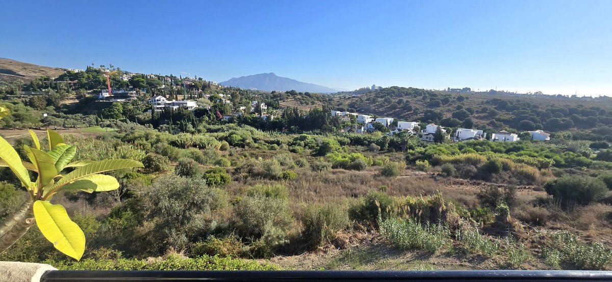Mountain view landscape with villa and surrounding greenery