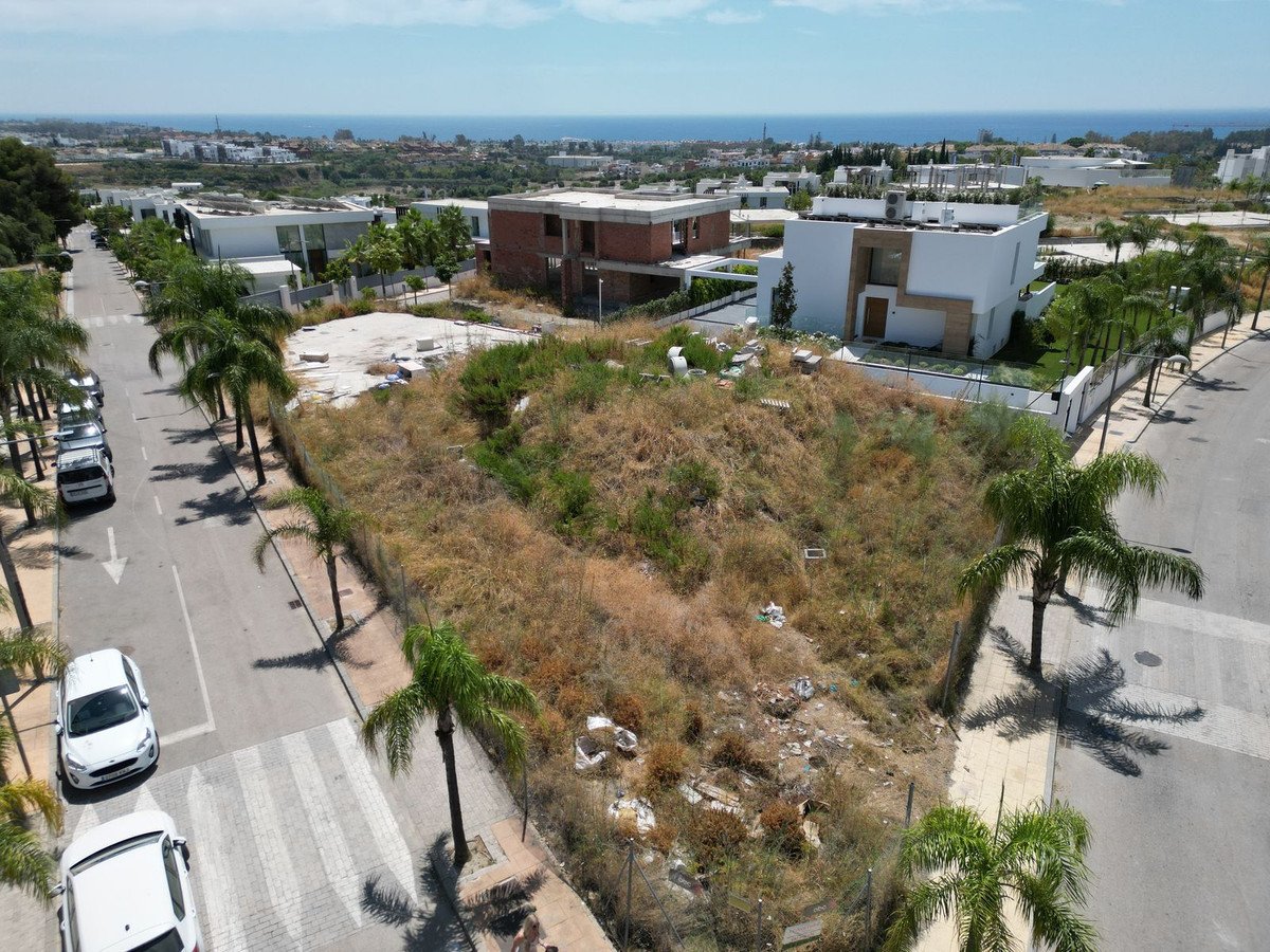 Aerial view of a vacant lot with sea view and palm trees