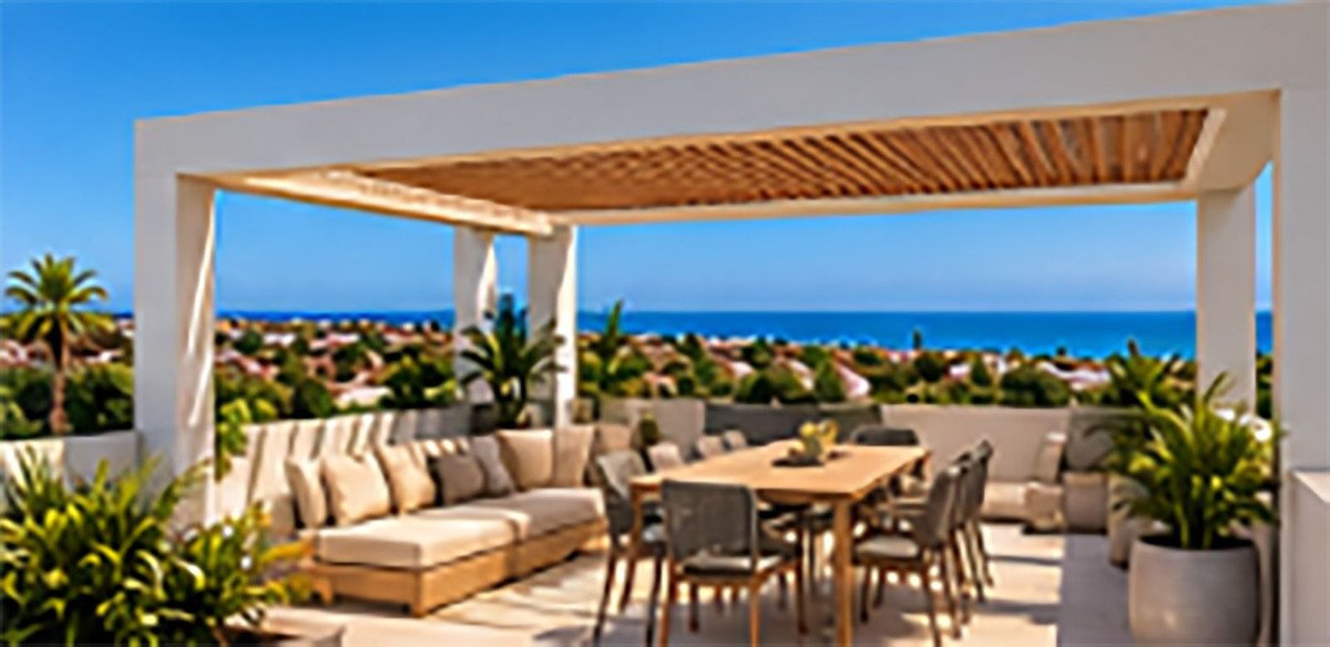 Rooftop terrace with ocean view, lounge seating, and dining table