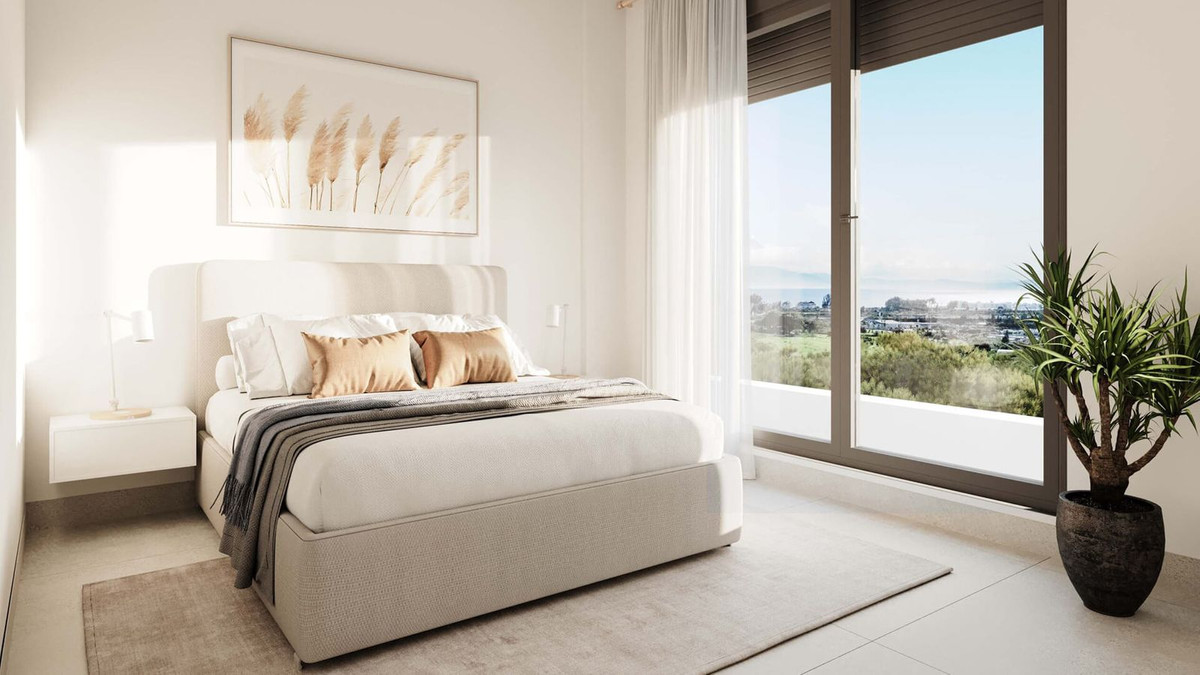 Moderne slaapkamer met prachtig uitzicht, lichte kleuren en strak design.