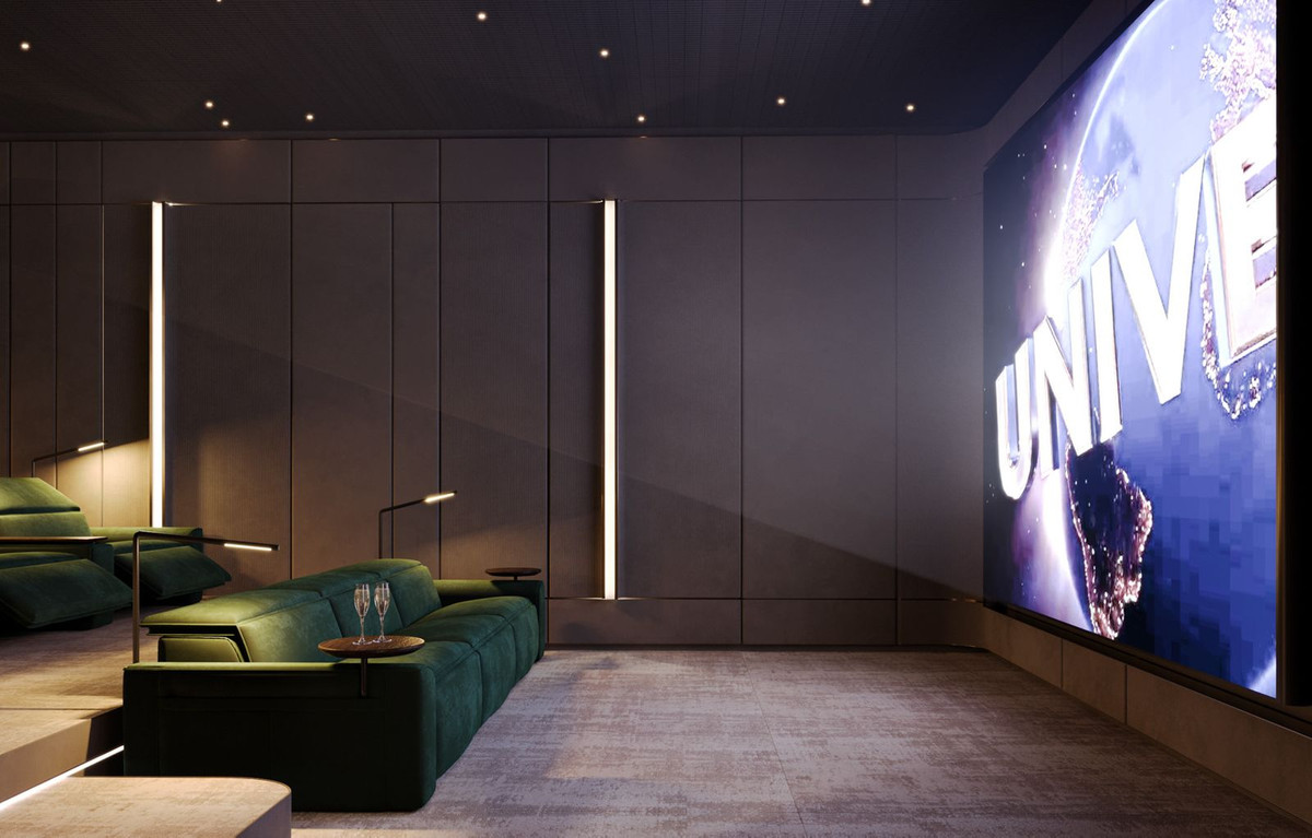 Privé-bioscoopzaal met groene banken en groot scherm.