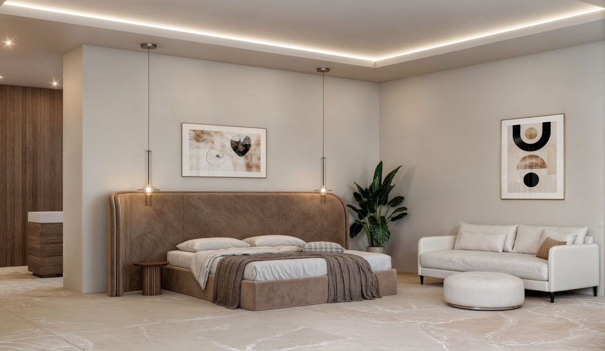 A luxurious bedroom featuring a king-size bed, plush sofa, modern art, and ambient lighting.