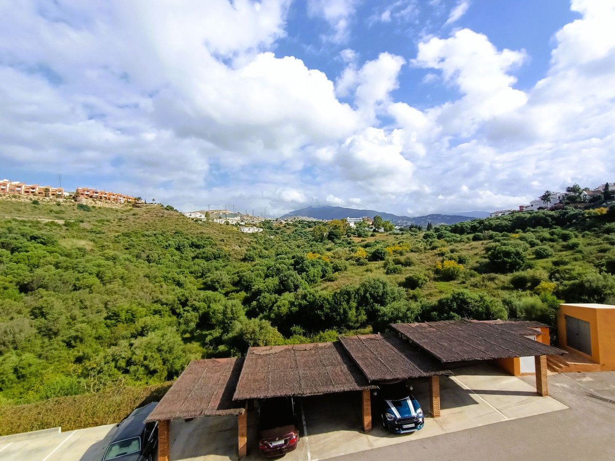 Outdoor parking with mountain and green landscape view