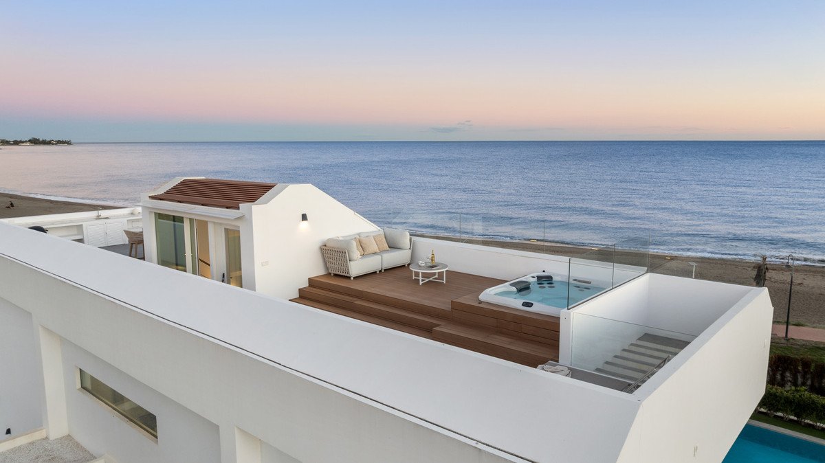 Modern rooftop terrace with sea view and hot tub overlooking the beach