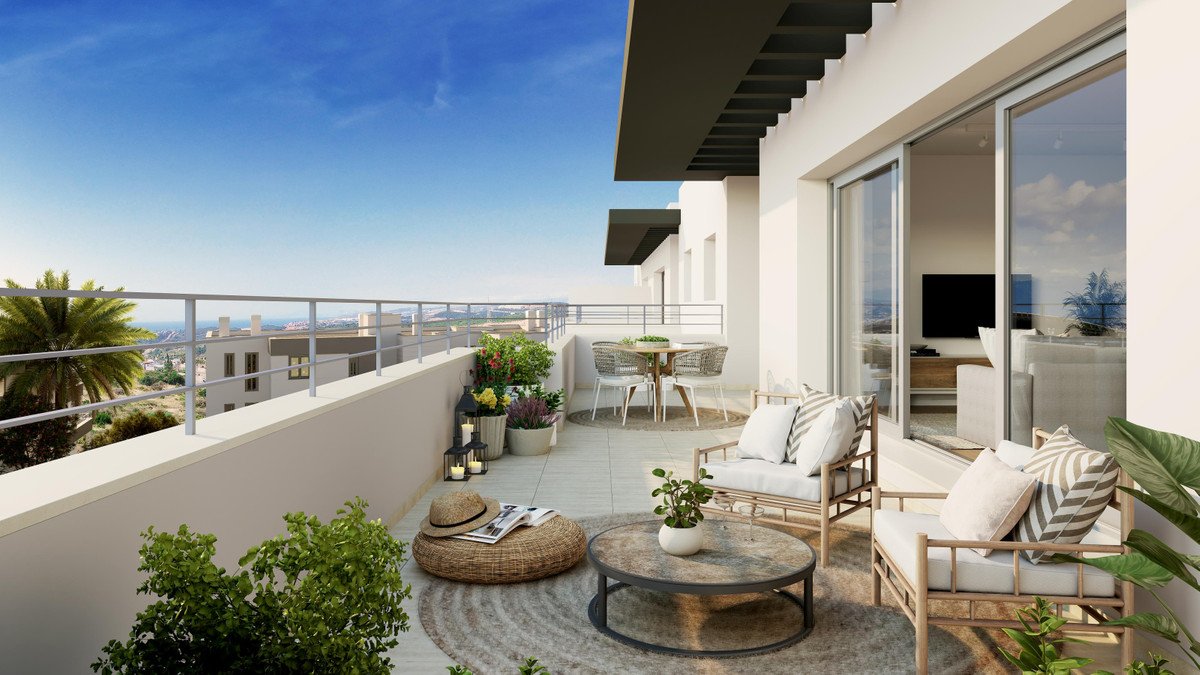 Modern balcony with city view, outdoor furniture, and plants.
