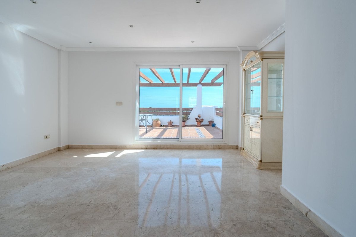Bright living room with sea view and sliding glass doors