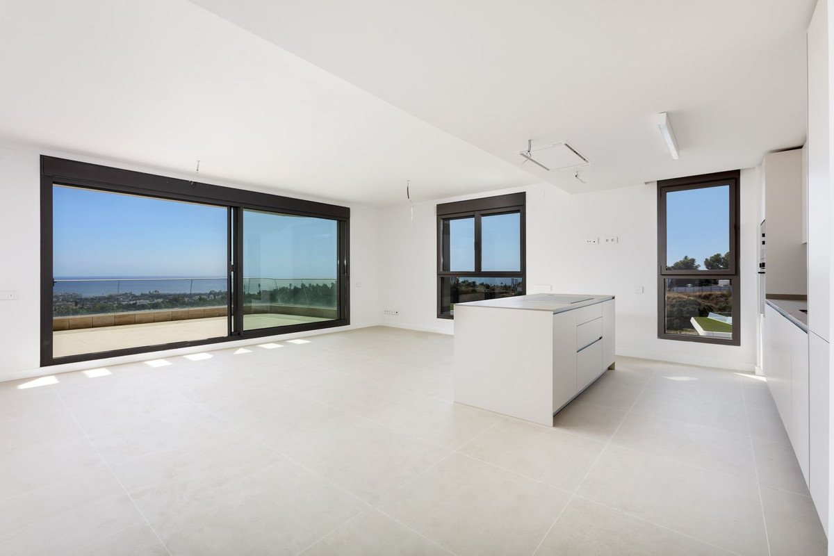 Modern open-plan living room with sea view and large windows