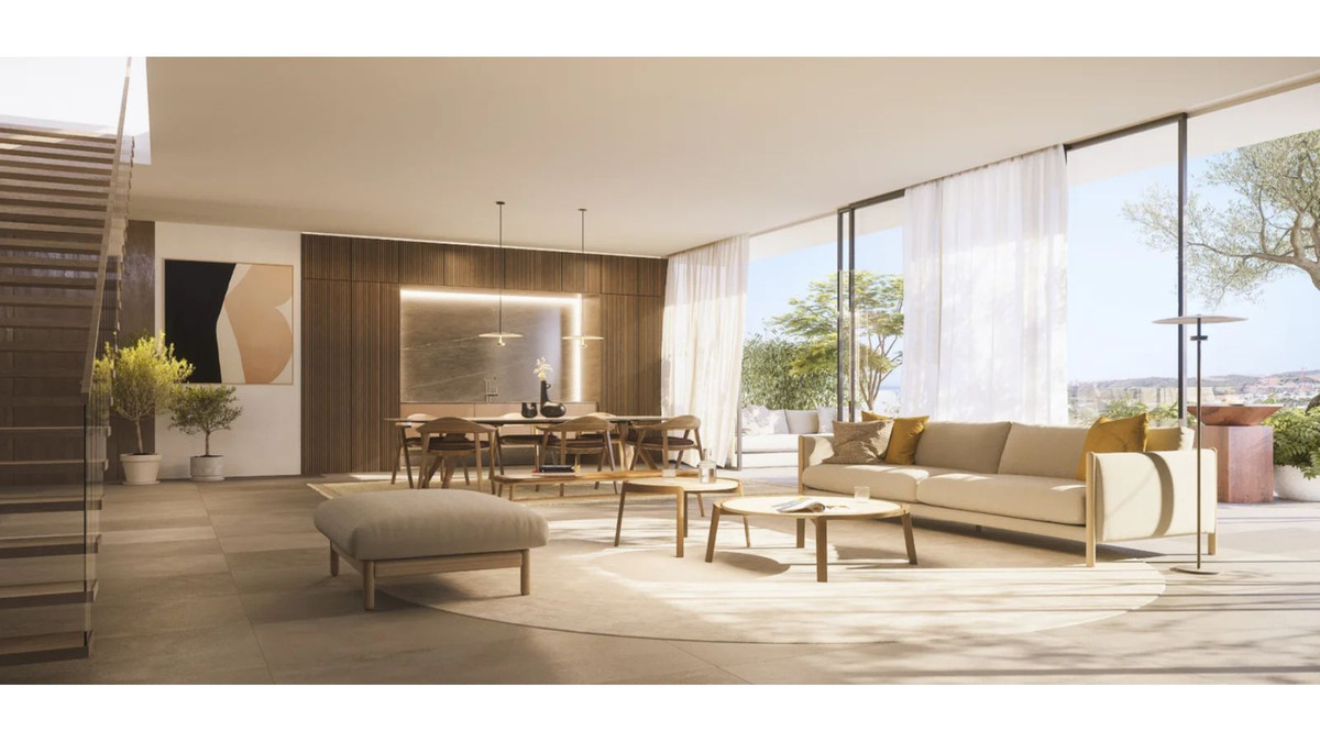 Ruime open woon- en eetkamer in One Estepona, met uitzicht naar buiten.