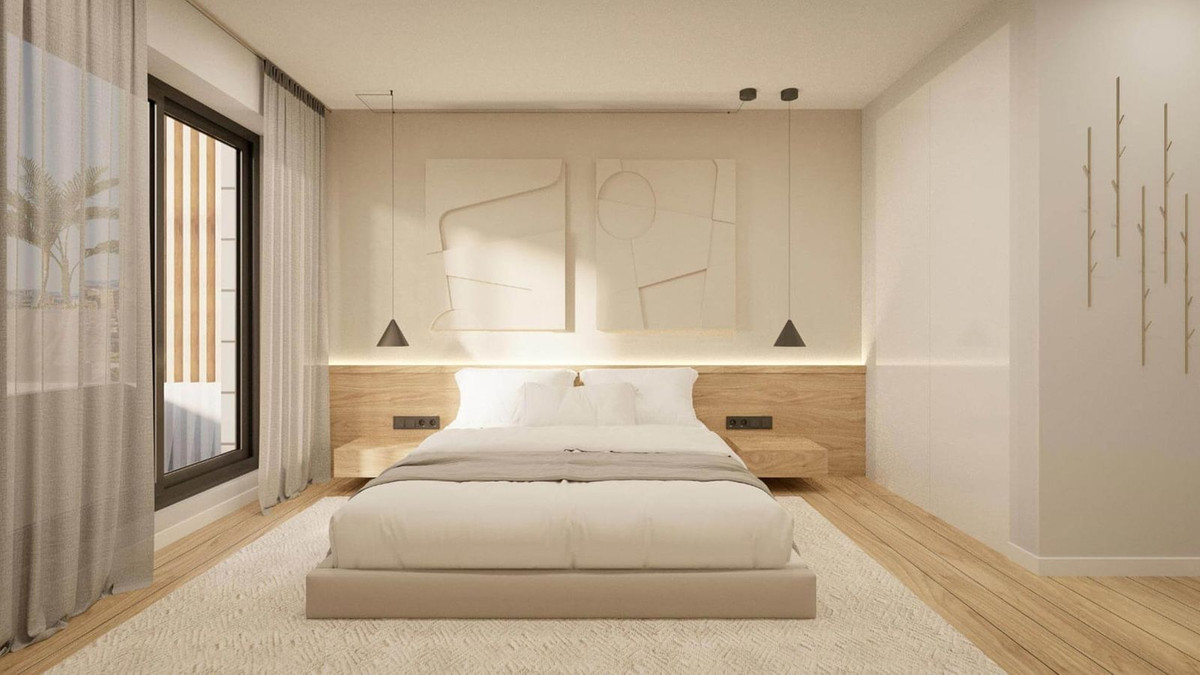 Moderne slaapkamer in kuststijl met lichte kleuren en houten accenten