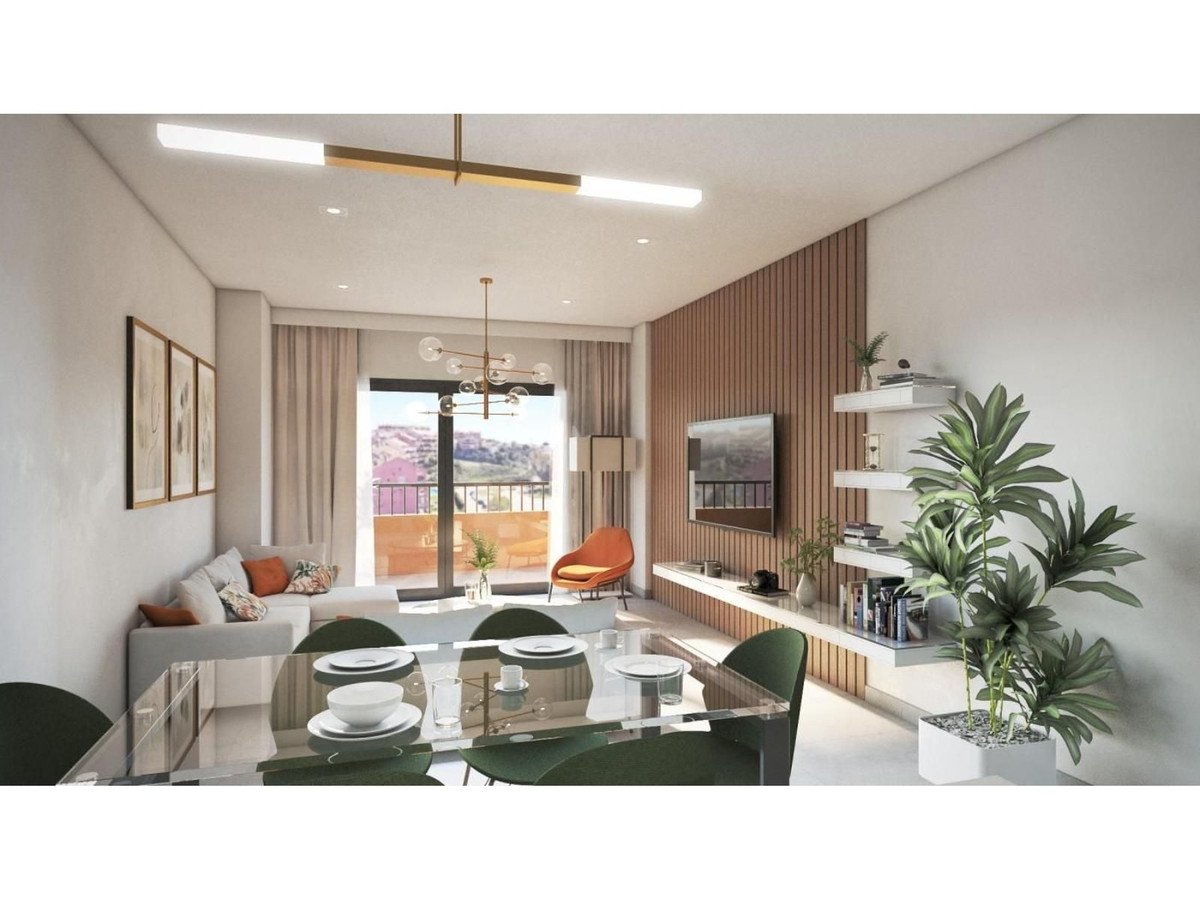 Modern dining room, large windows, city view, glass table, and green chairs.