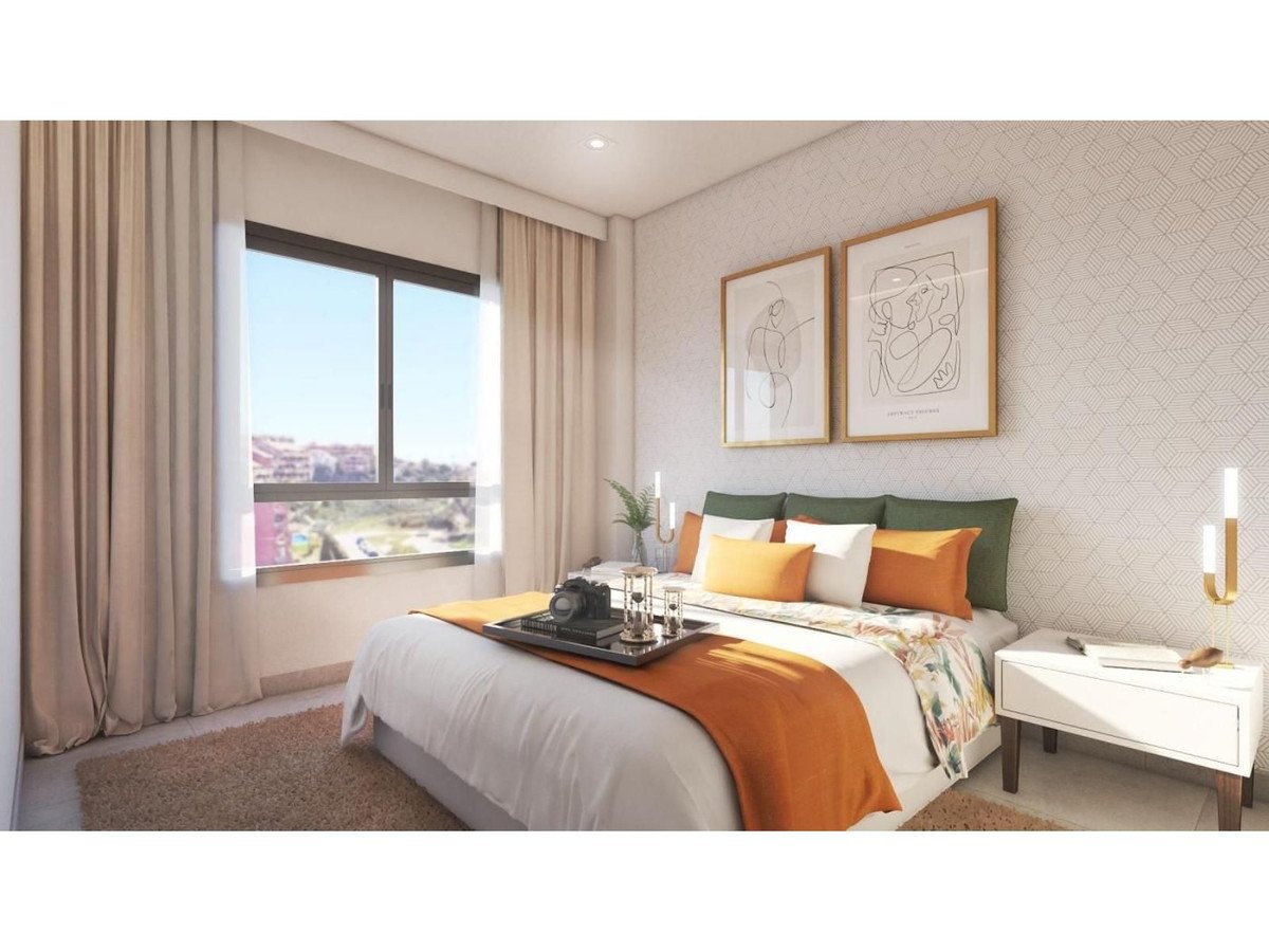 Modern bedroom with large window, city view, and minimalist decor.