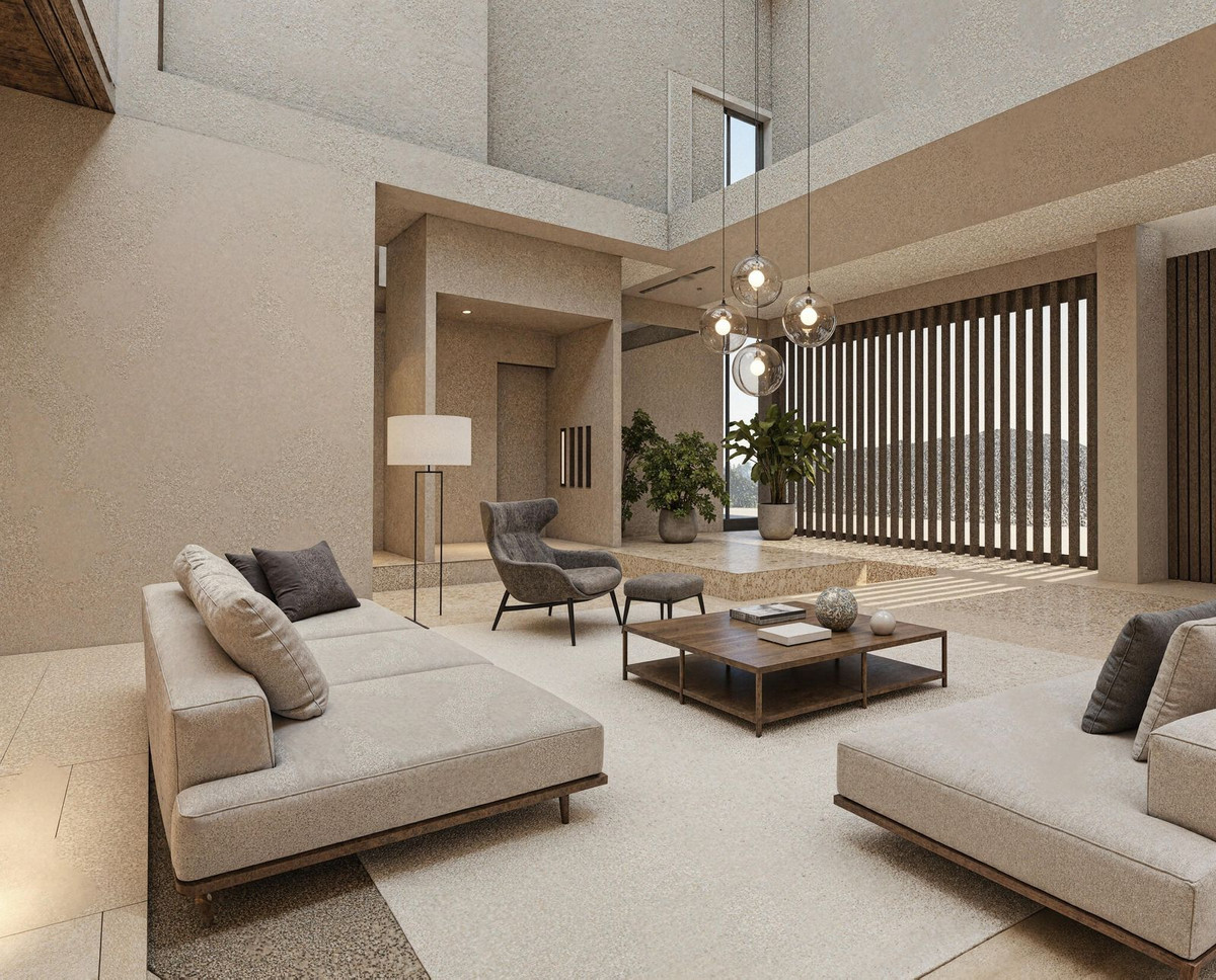 Moderne, neutraal getinte woonkamer met designmeubels en veel natuurlijk licht.