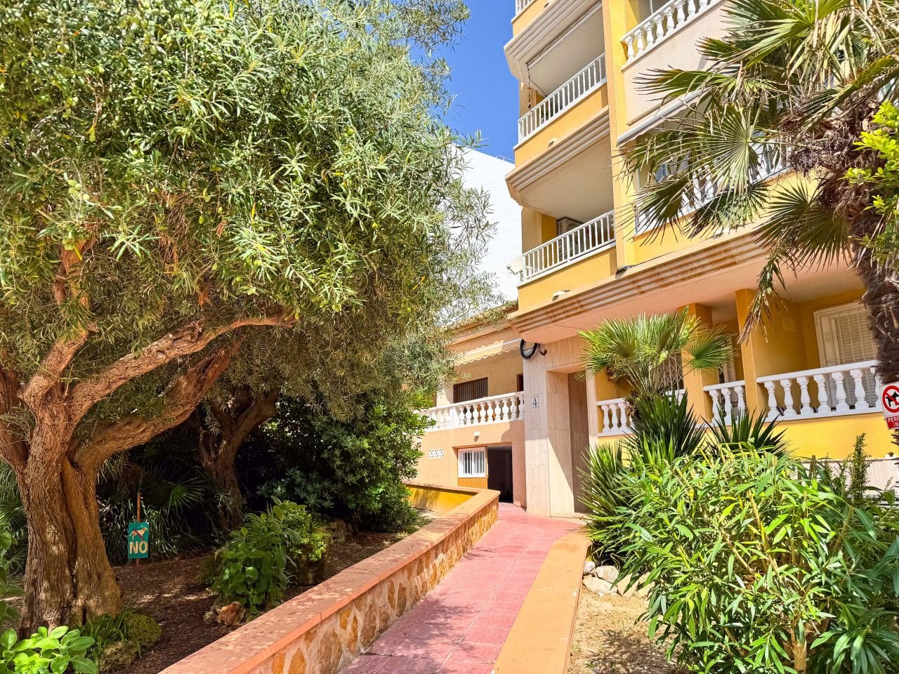 A cozy apartment with a balcony, featuring a garden view and modern amenities.