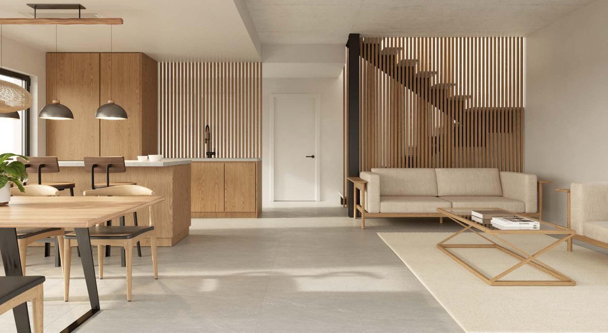 Modern living, dining, and kitchen area with natural wood accents, slatted wood features, and comfortable seating.