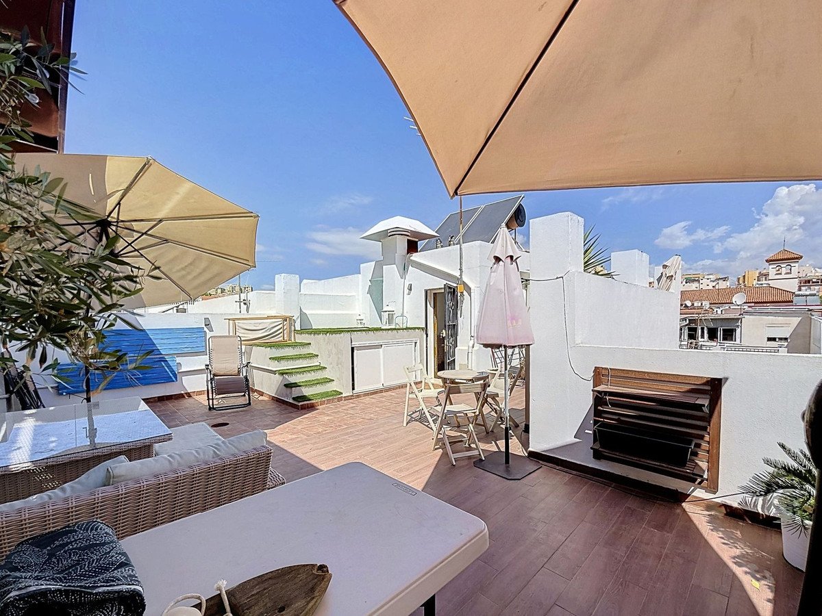 Rooftop terrace with seating, small pool, and urban views. Perfect for outdoor relaxation.
