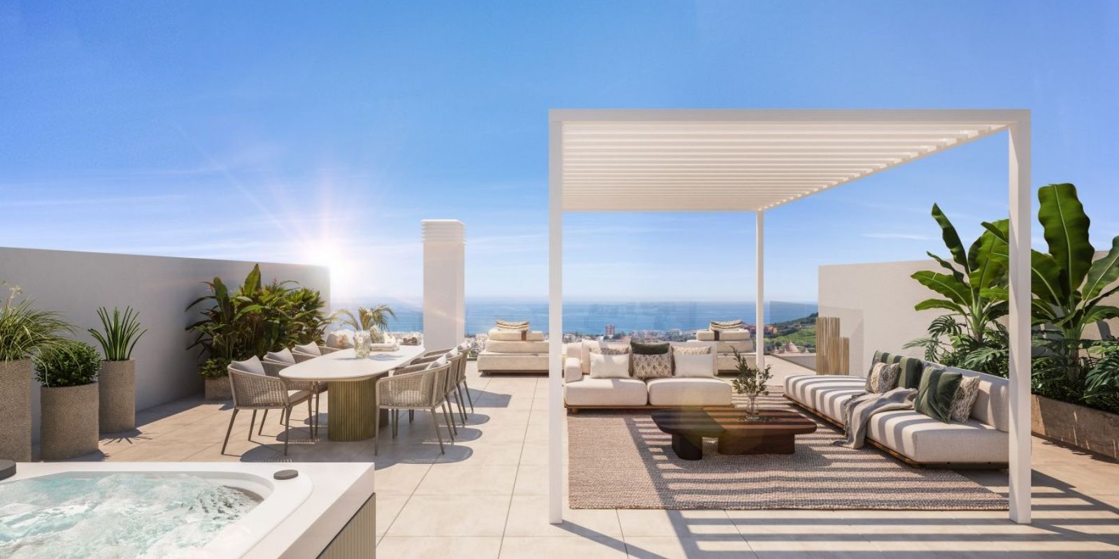 Luxe dakterras met uitzicht op zee, zitgedeelte en eettafel.