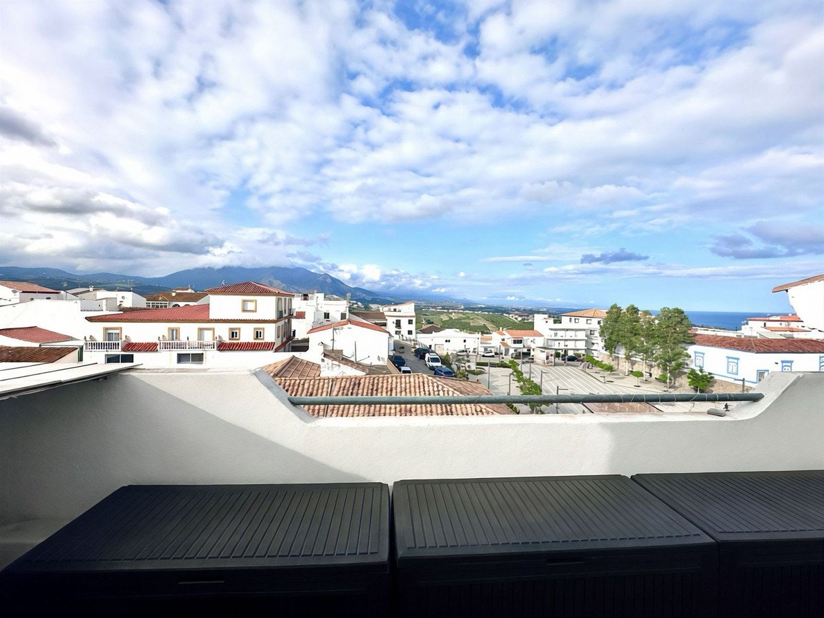 Town view with mountains and sea in the background