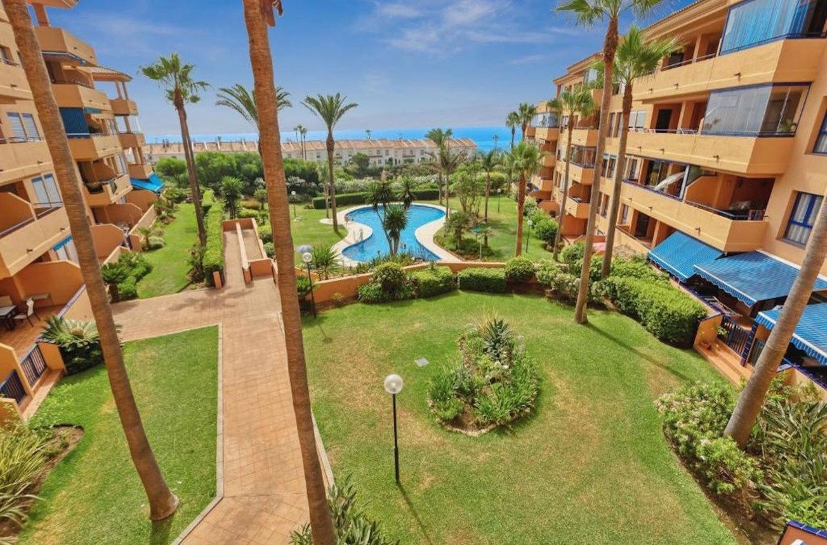 Luxury condo complex with swimming pool and ocean view