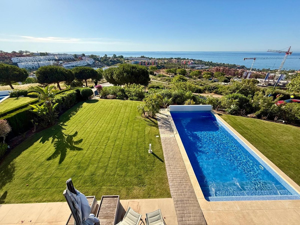 Luxurious swimming pool overlooking a scenic coastal landscape with ocean view