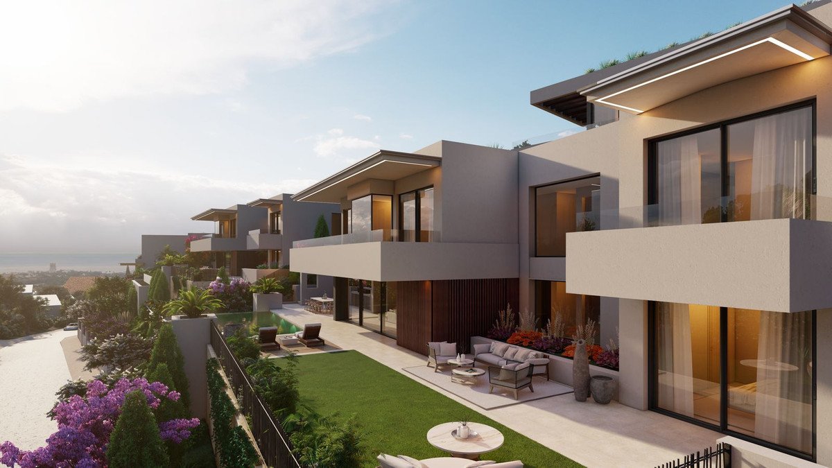 Modern villas with swimming pool, garden, and balconies overlooking the sea and cityscape.