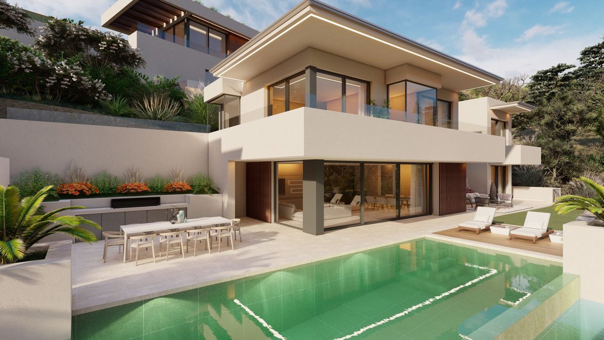 A modern villa with a swimming pool, outdoor dining area, and lounge chairs under a bright sky.
