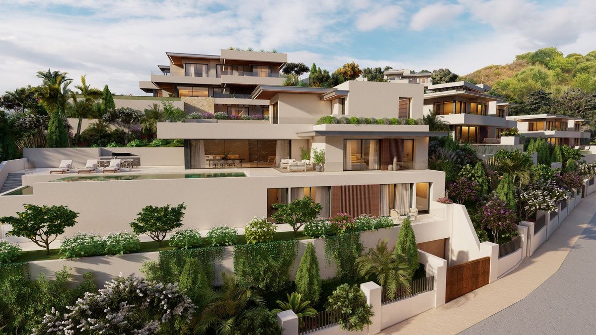A modern multi-story villa with a swimming pool, lounge chairs, and lush landscaping on a hillside.