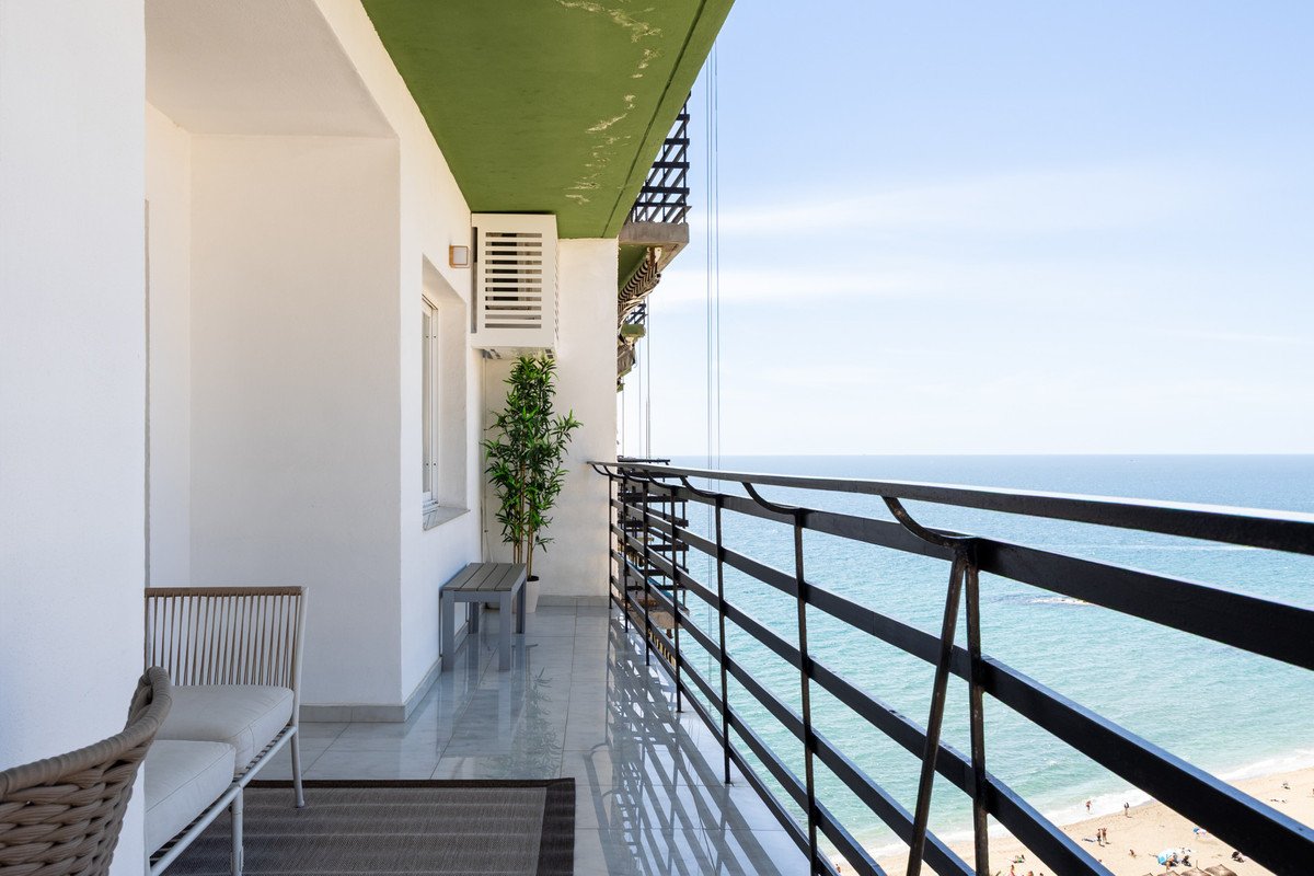 Balcony with sea view and beach in the background