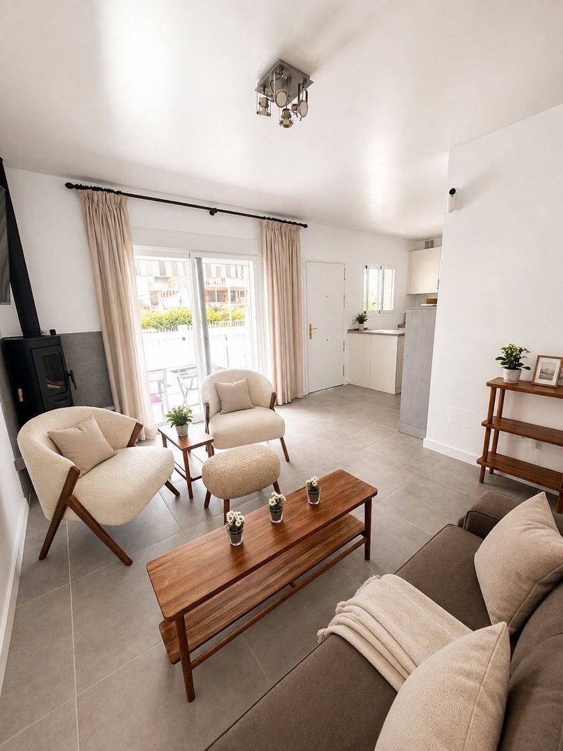 Spacious living room with open-plan layout, comfortable seating, and bright natural light.