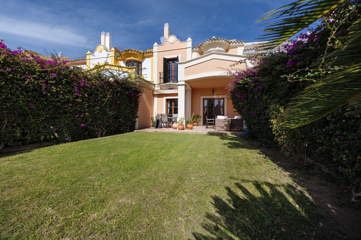 Villa with backyard garden, patio, and outdoor seating area