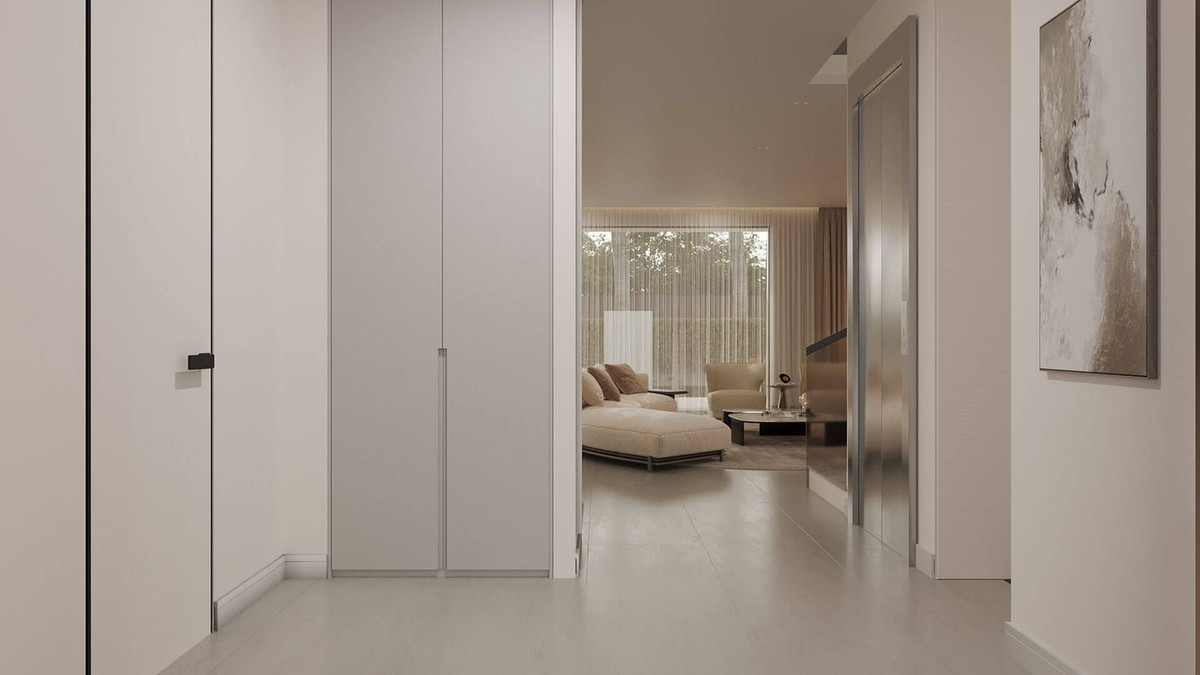 Moderne villa hal met uitzicht op de woonkamer.