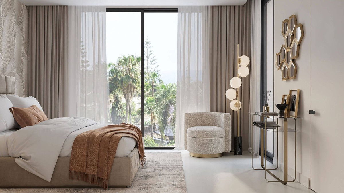 Slaapkamerinterieur in Sirocco Villas met uitzicht op palmbomen.