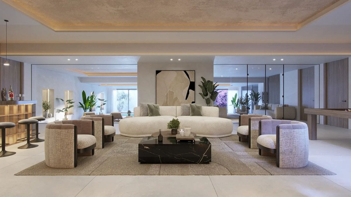Luxurious modern living room with a bar, contemporary sofas, and comfortable armchairs, illuminated by soft ambient lighting.